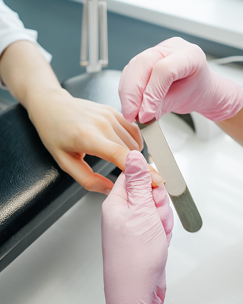 side view of process of manicure, salon.